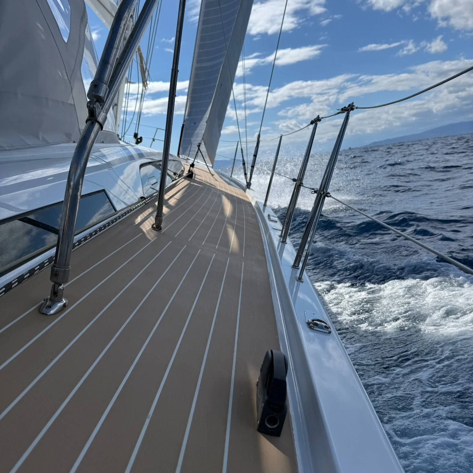 View along the bow and deck of NAIS under way